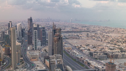 Fototapeta premium Dubai Downtown skyline futuristic cityscape with many skyscrapers and Burj Khalifa aerial timelapse.