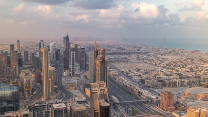 Fototapeta na wymiar Dubai Downtown skyline futuristic cityscape with many skyscrapers and Burj Khalifa aerial timelapse.