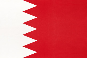 Bahrain national fabric flag, textile background. Symbol of international asian world country.