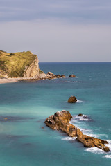 views of rock formations and beach at durdle dor