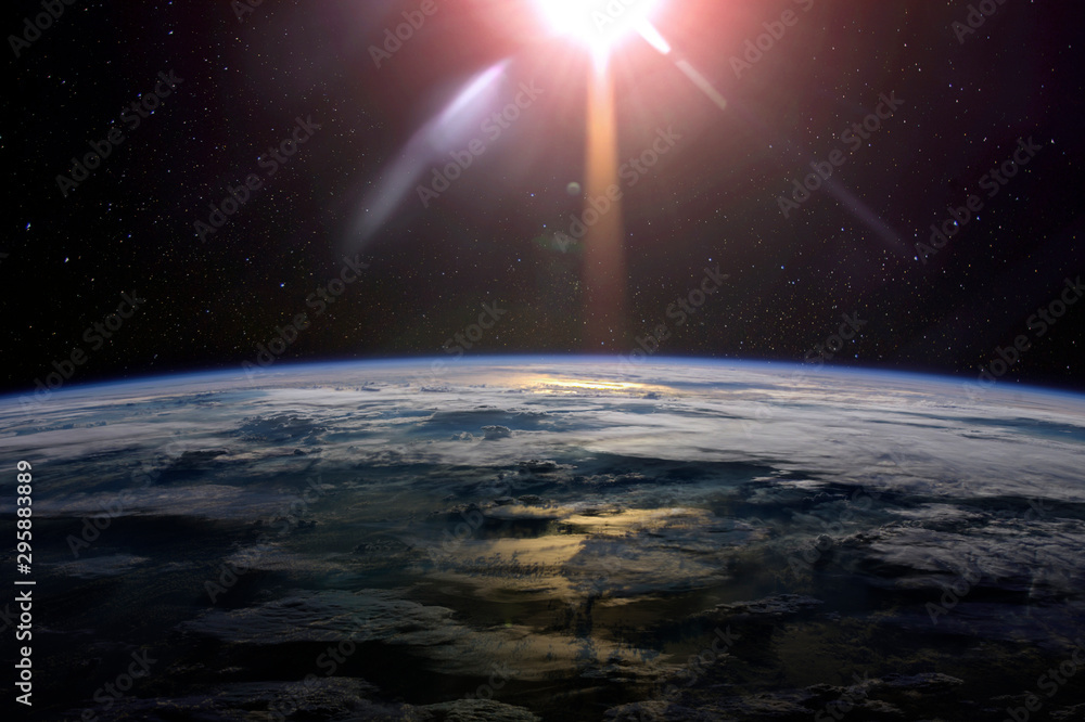 Sticker view of the planet earth from space with clouds during a sunrise. elements of this image furnished b