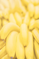 Fresh clear banana sunny yellow background texture vertical light coloured