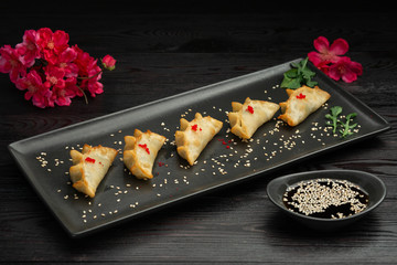 ebi gedza chinese fried dumplings with shrimp and vegetables, served with sauce