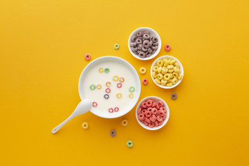 Top view delicious bowls of milk with cereal