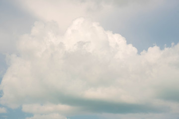 Large Cumulonimbus clouds and tall clouds there is dark on the bottom