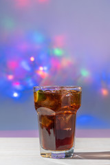 drink of cuba libre with colorful lights background