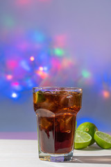 drink of cuba libre with colorful lights background