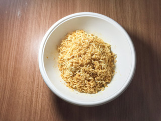 Noodles in a wooden table top cup