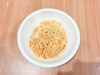 Noodles in a wooden table top cup