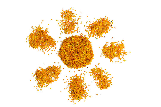 The sun shaped isolated bee pollen grains on a white background. Healthy natural medicine concept