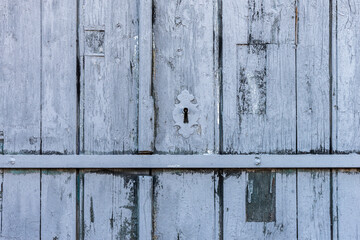 Old and wethered wood door, painted blue