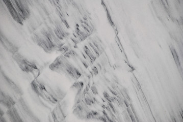 drawing on a white marble slab