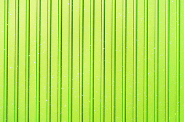 Bright abstract light green striped background. Texture of grill pan.