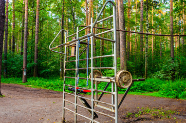 Fototapeta premium Outdoor gym in the woods. Playground on the street.
