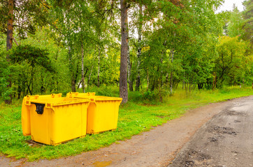 Garbage cans in the woods.Cleanliness in the parks.