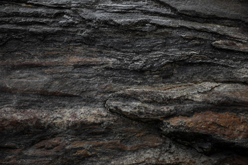 Dark gray black slate stone texture background.