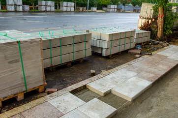 Repair of the sidewalk.Replacing tiles on the Alley.