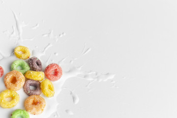 Close-up colorful cereal with splash of milk