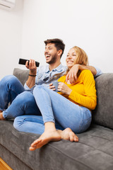 Fototapeta na wymiar couple in love watching tv