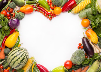 Heart shape copy space surrounded by fresh vegetables