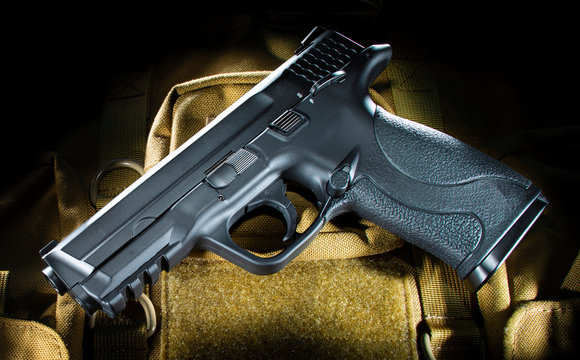 Semi auto handgun on tan material