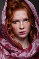 Beautiful portrait of a red-haired teenager girl.