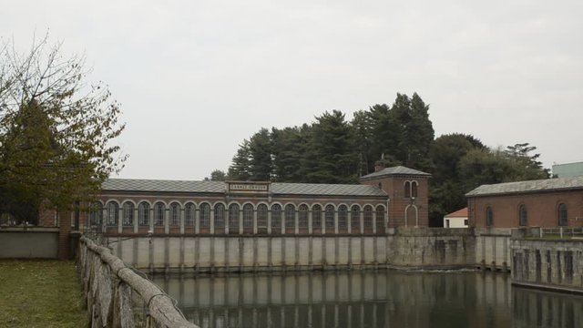 Chivasso, Piedmont, Italy. October 2019. The Cavour canal is a great work from the 1800s that captures the waters of the river Po. In the video the red brick sewer. Tilit movement