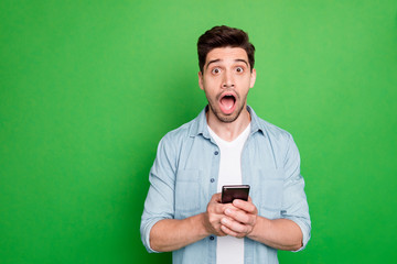 Photo of amazing guy holding telephone read instagram post negative comments not believe eyes open...