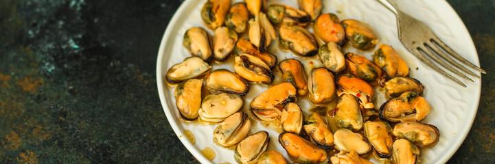 mussels in oil and spices (appetizer mollusks, pickled seafood, healthy food) menu concept. food background. copy space. Top view