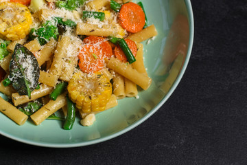 pasta salad, vegetables, mix leaves (tomato, onion, lettuce, chard, arugula and more italian ) menu concept. food background. copy space. Top view
