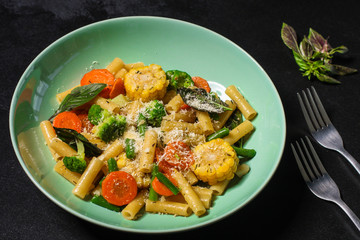 pasta salad, vegetables, mix leaves (tomato, onion, lettuce, chard, arugula and more italian ) menu concept. food background. copy space. Top view