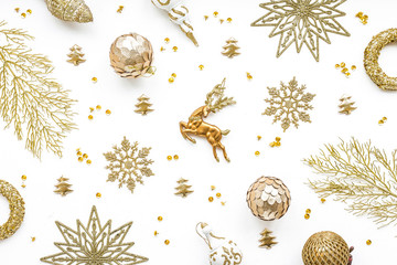 Gold christmas decoration on white background, flat lay, top view