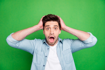 Photo of crazy horrified fearful man holding his head after having known the worst news in the...