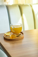 tea, honey, lemon and sea buckthorn (aromatic mustard drink in a cafe restaurant) menu concept. food background. copy space. Top view