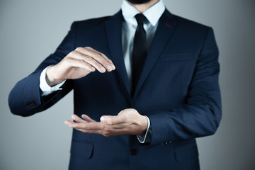 business man empty hand on gray background