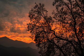 A fiery sunset in the mountains over looking a valley in central Chile.  