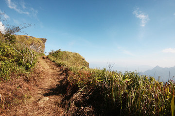 Beautiful landscape valley of mountain and blue sky in winter at Phu Chee Fah hill northern of Thailand