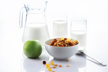 Health food. Muesli with milk and the baked apple. High key. Close up. Selective focus.