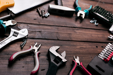 Hand tools on wooden background