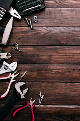 Hand tools on wooden background