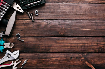 Hand tools on wooden background