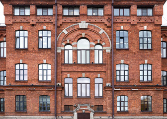 Fototapeta na wymiar Vintage architecture red brick facade building front view