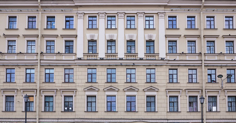 Vintage architecture classical facade building decorated antique pattern meander running wave front view