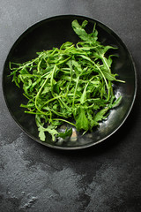 arugula, healthy salad, greens (delicious snack, healthy diet) menu concept. food background. copy space. Top view