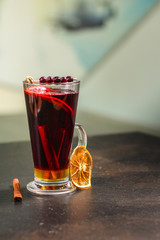 mulled wine on a wooden table. Traditional hot drink at Christmas (red wine with spices, New Year's Eve, Noel holiday festive) x-mas flat lay. food background. copy space. Top viev
