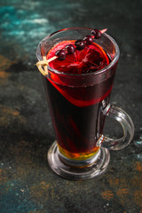 mulled wine on a wooden table. Traditional hot drink at Christmas (red wine with spices, New Year's Eve, Noel holiday festive) x-mas flat lay. food background. copy space. Top viev