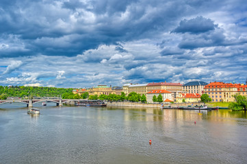 Fototapeta na wymiar A view of Old Town Prague and the Charles Bridge across the Vltava River in Prague, Czech Republic.
