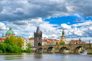 Fototapeta premium A view of Old Town Prague and the Charles Bridge across the Vltava River in Prague, Czech Republic.