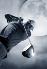 golf swing and a big moon