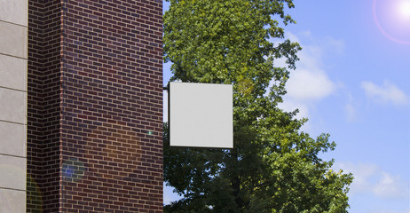 Blank white square banner mock up on brick wall mounted